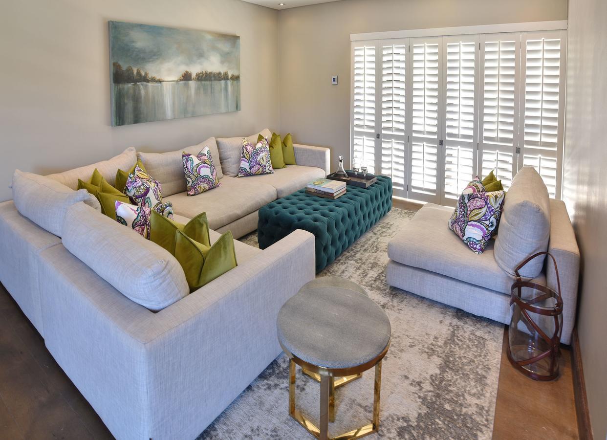 Tredenham Boutique Hotel Блумфонтейн Экстерьер фото A living room with plantation shutters